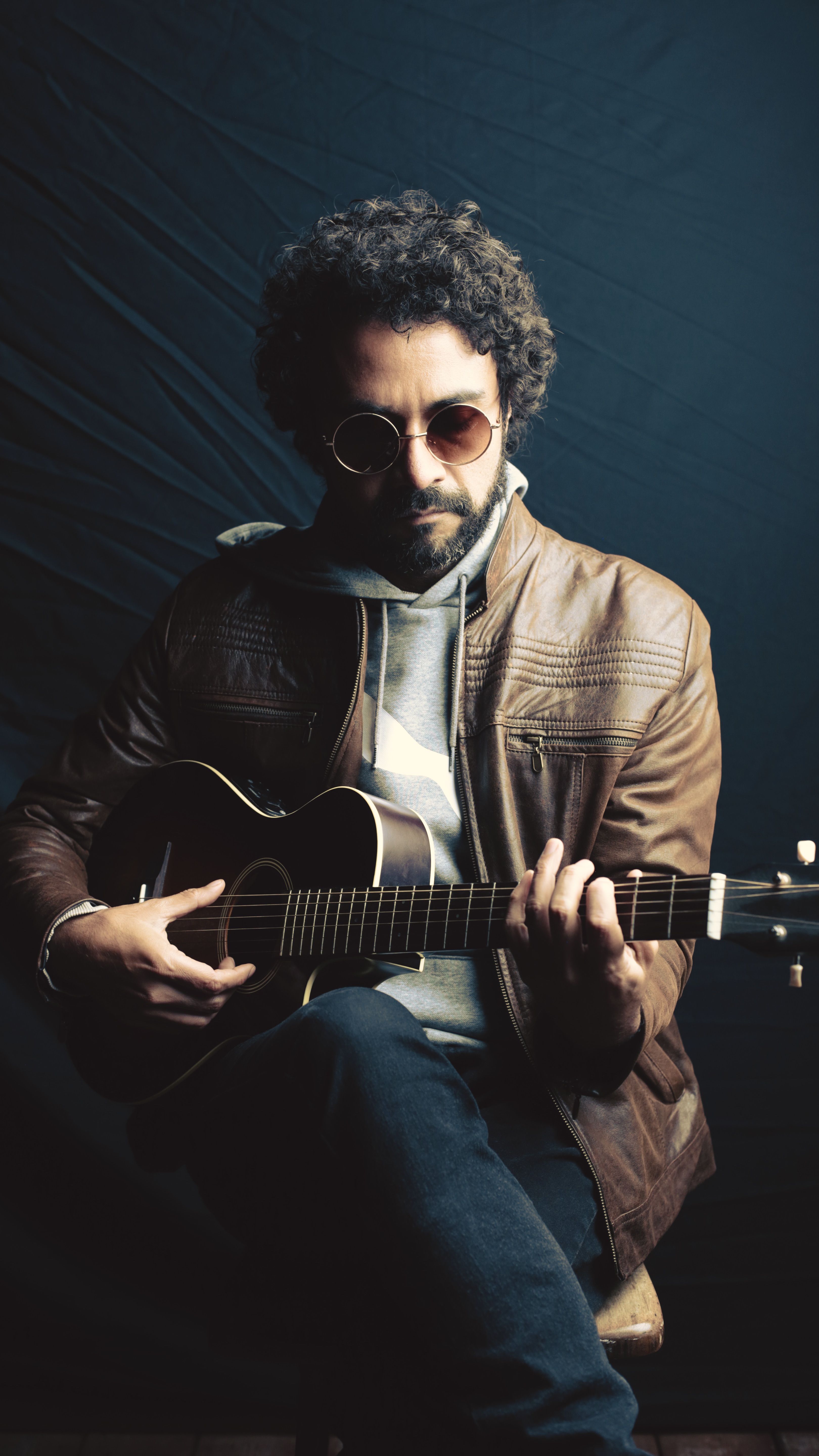 a man holding a guitar