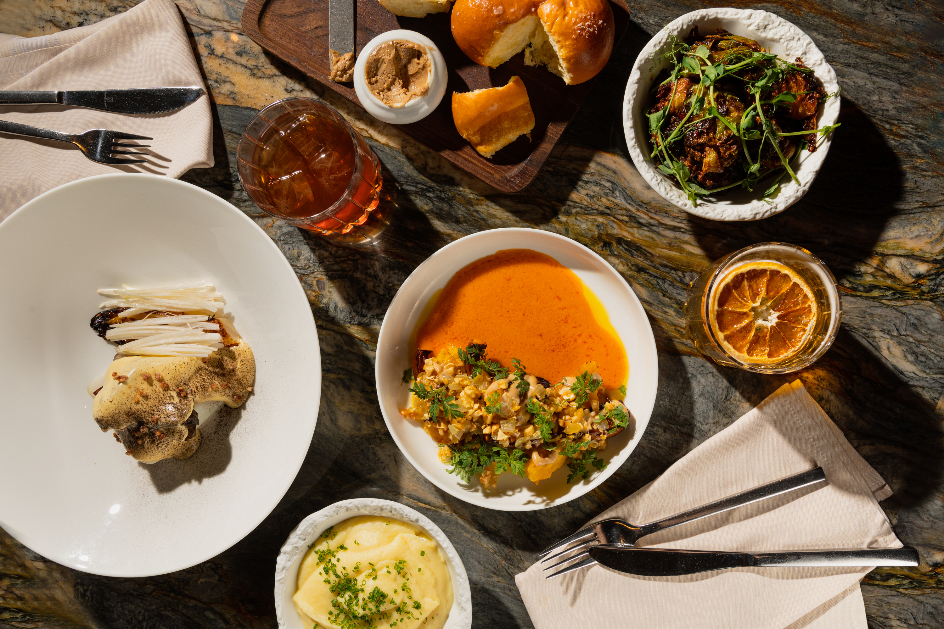 A table laden with an assortment of delicious foods, showcasing a vibrant spread of colors and textures