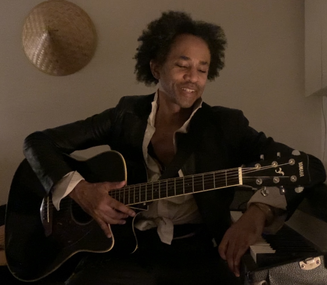 a man holding a guitar