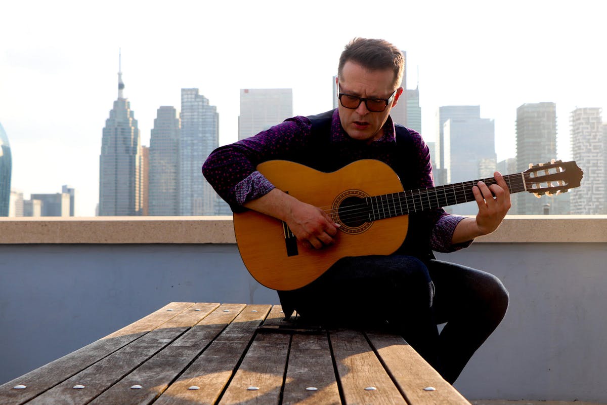 a man holding a guitar
