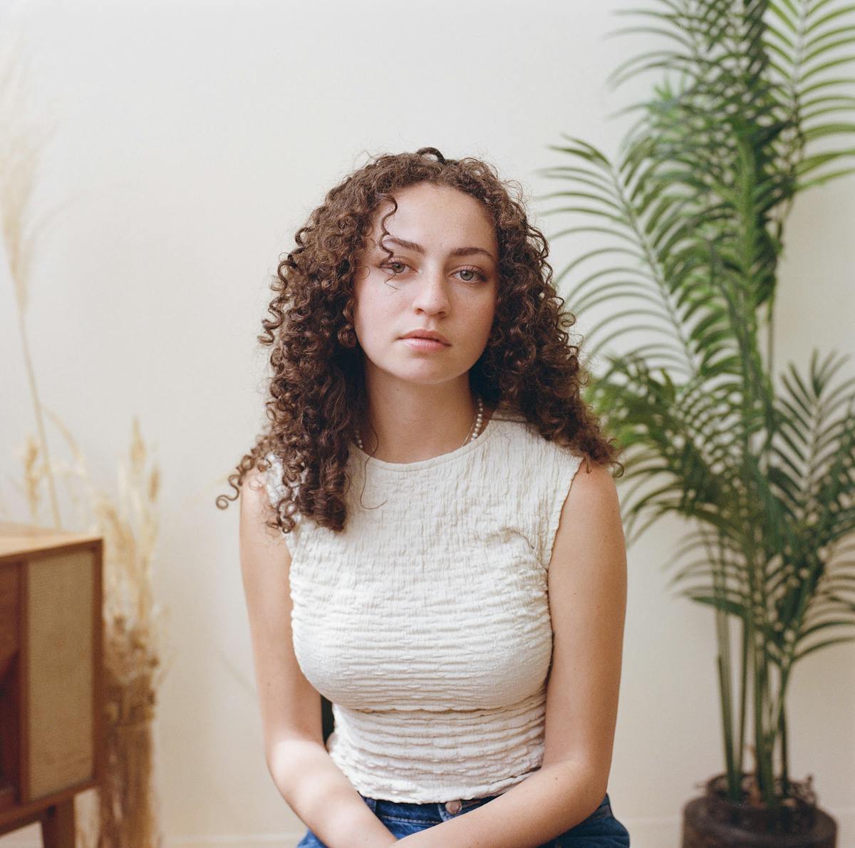 a person standing in front of a cake