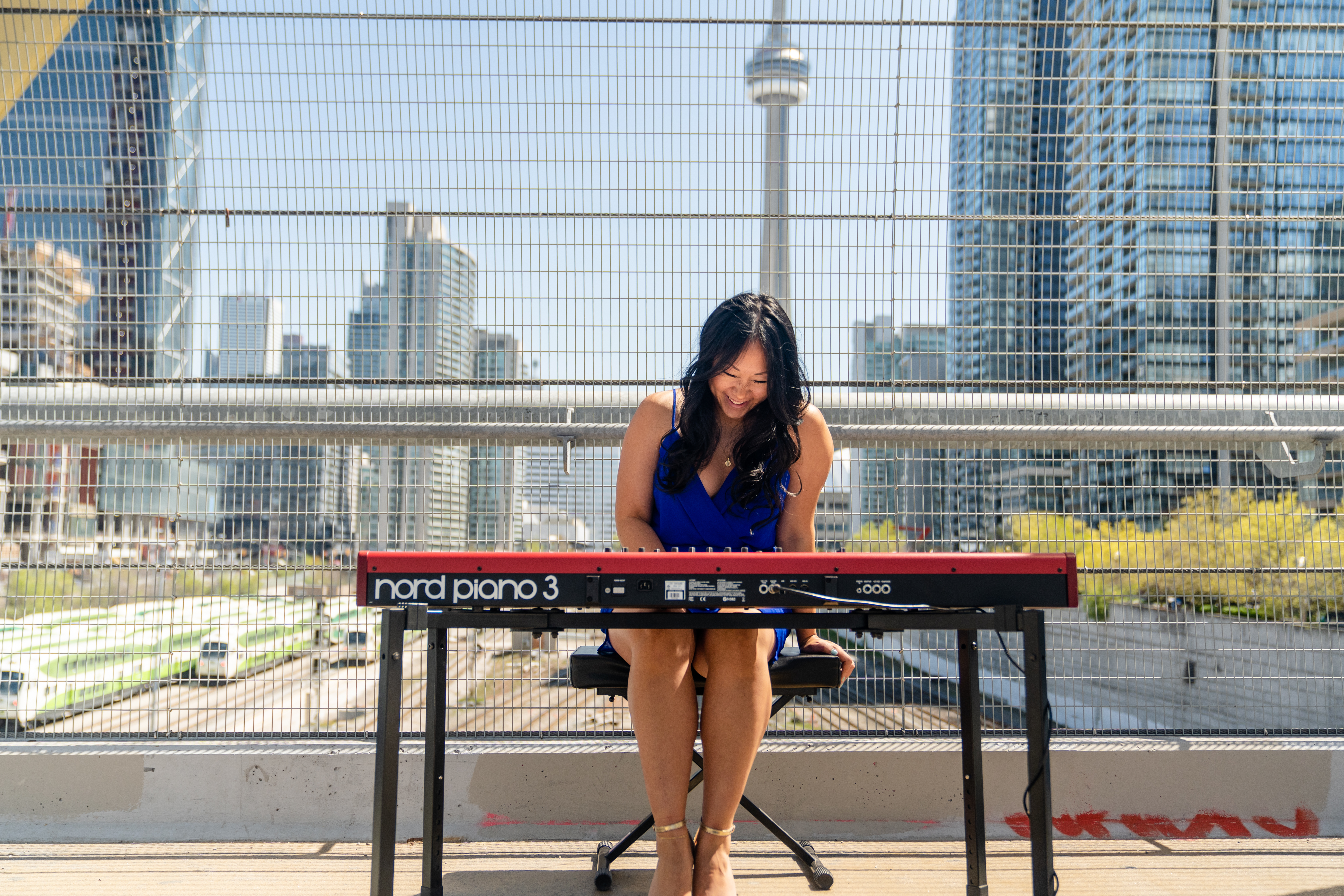 a woman sitting at a keyboard