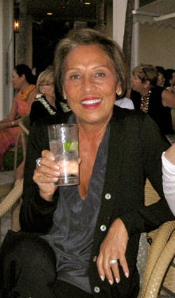 a group of people holding wine glasses