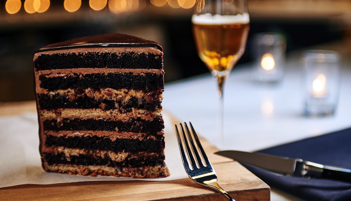 a close up of a piece of cake sitting on top of a table