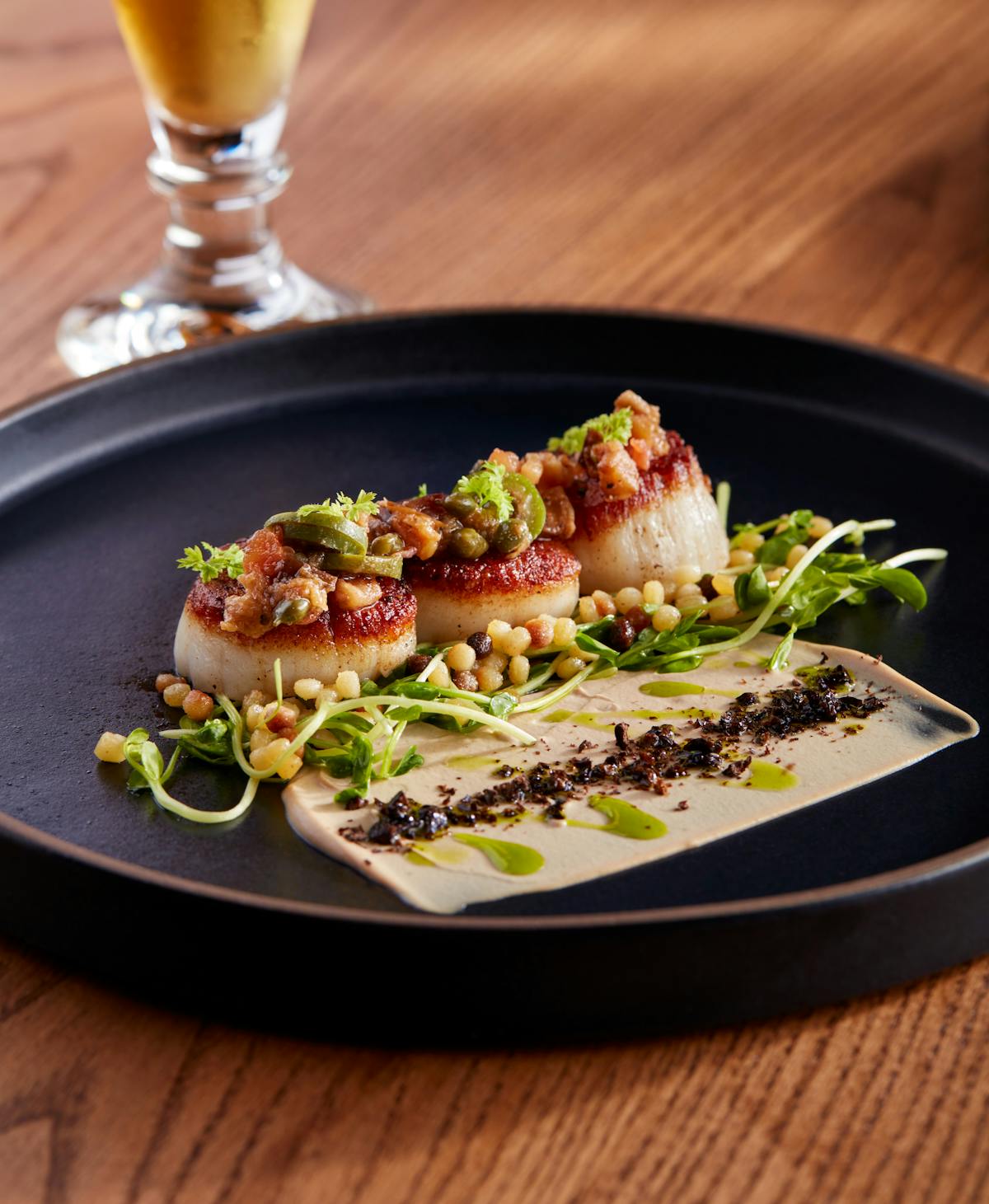 a plate full of food sitting on top of a wooden table