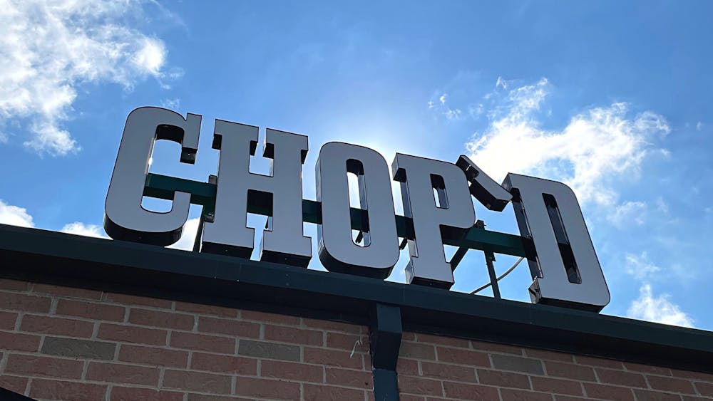 a sign in front of a brick building