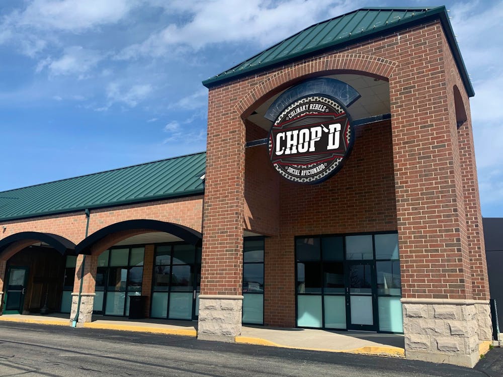 a sign in front of a brick building