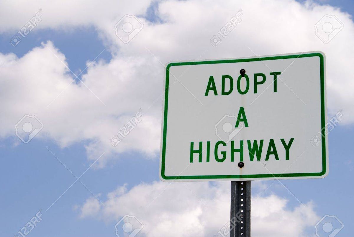 a sign on a cloudy day