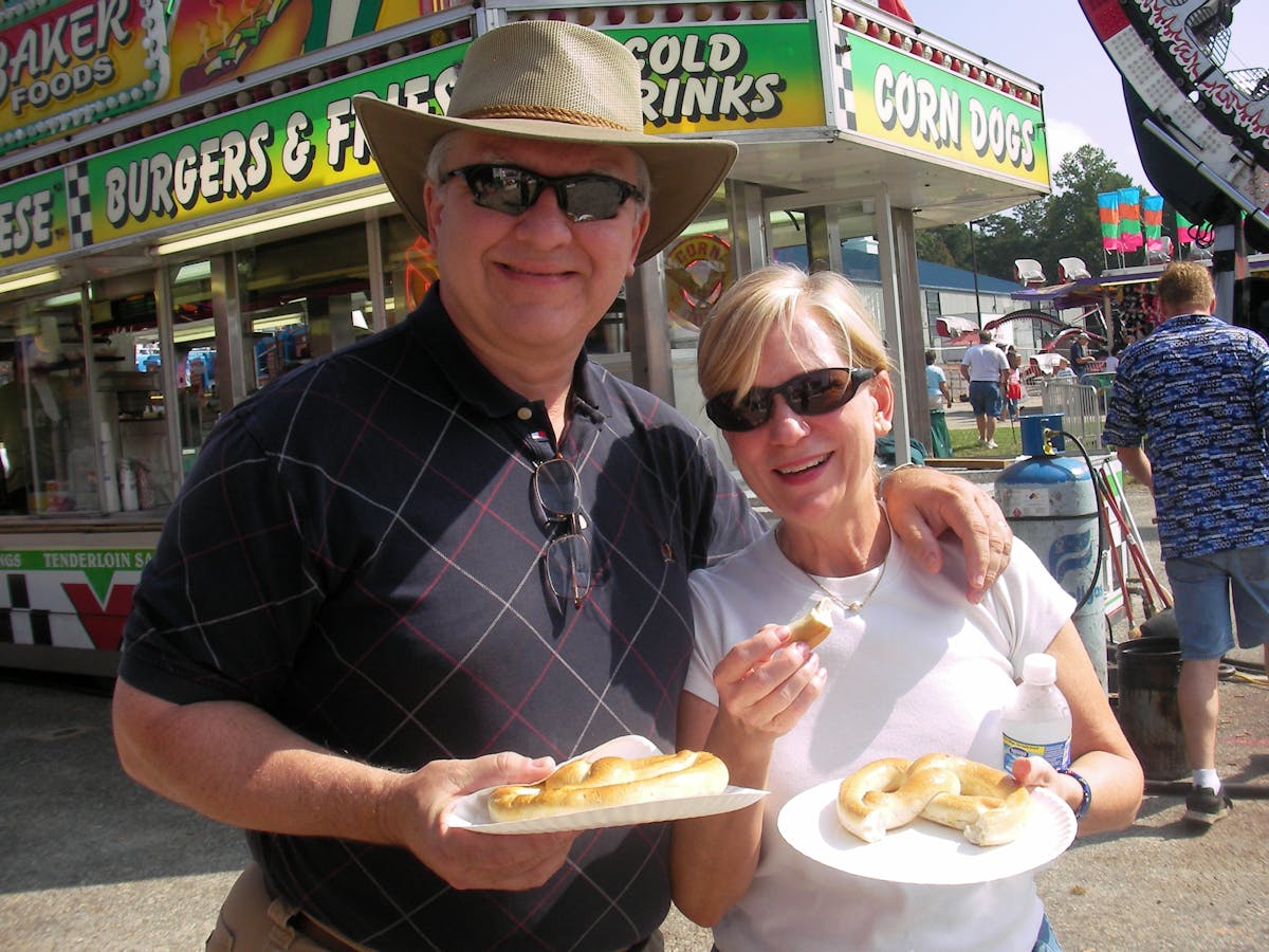 a woman eating a hot dog