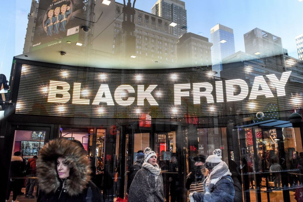 a group of people standing in front of a store