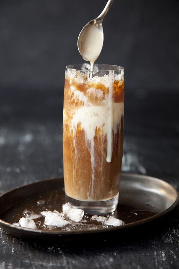 a cup of coffee and a glass of orange juice