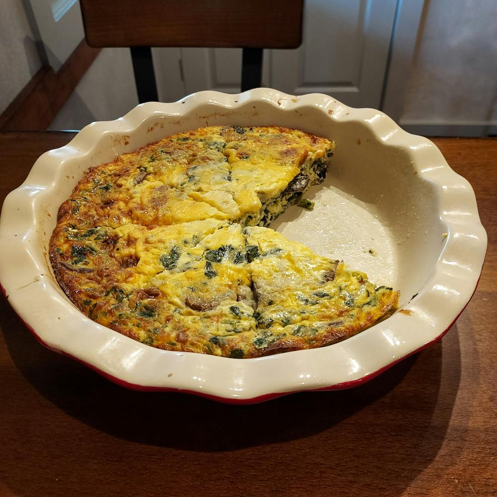 a plate of food with a slice of pizza