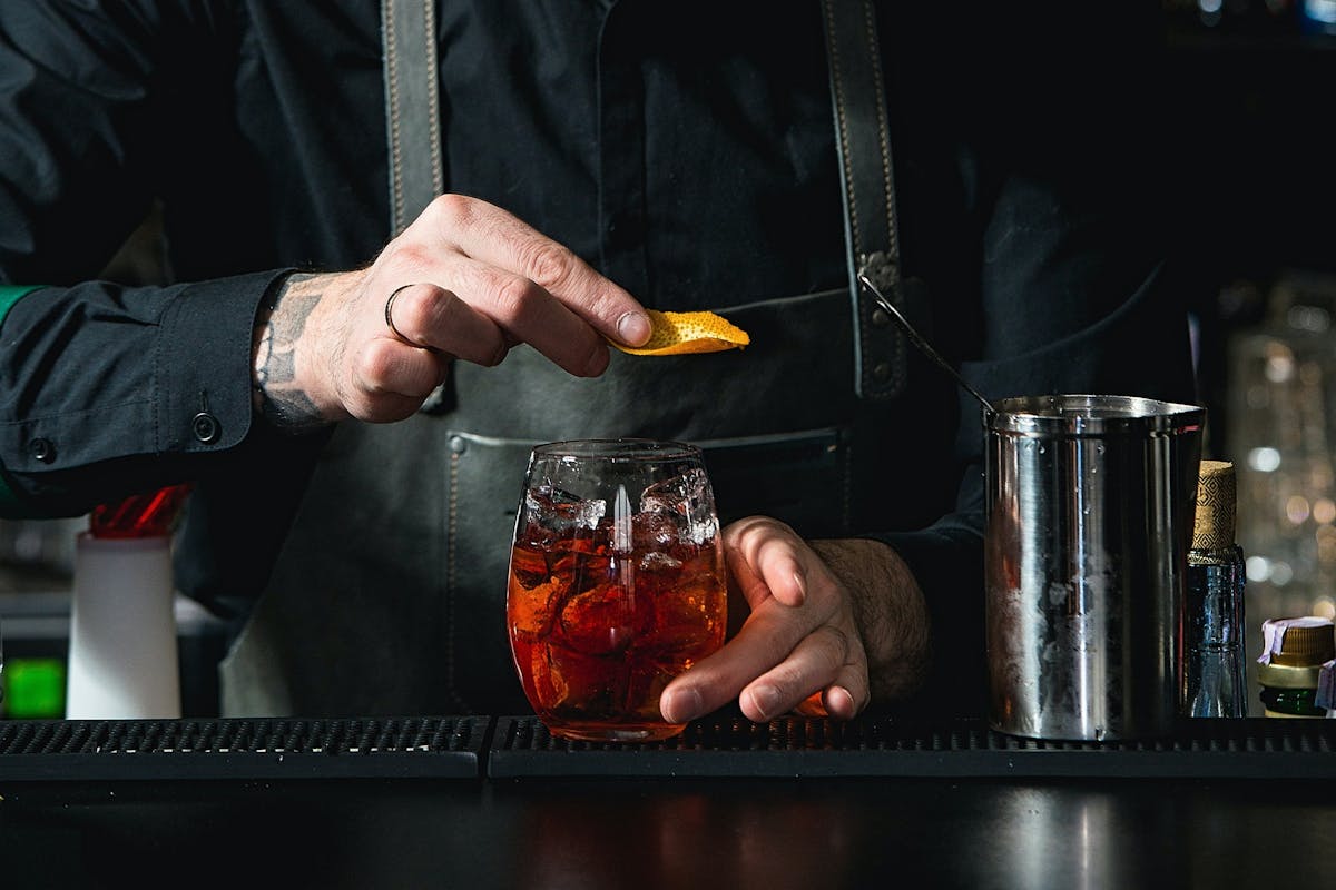 a bartender making a cocktail