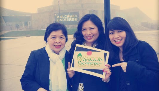Photo of Mary Nguyen Aregoni and Theresa Nguyen, along with their mother, Mama Suu