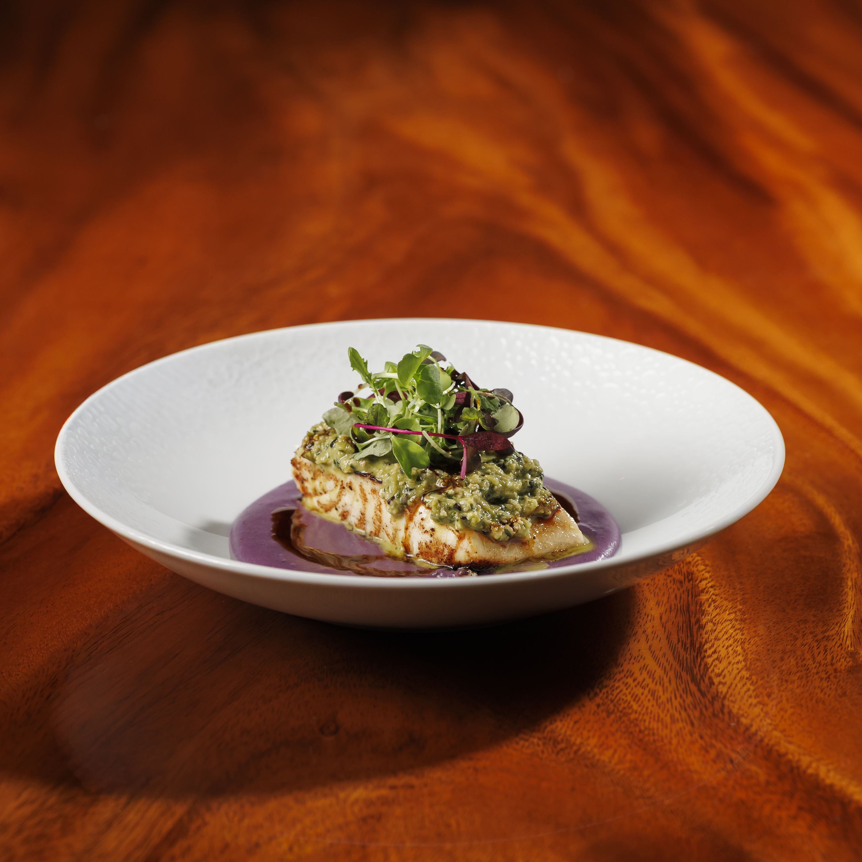 Seared Atlantic Halibut: okinawan sweet potato puree, edamame chimichurri, ginger teriyaki, baby greens