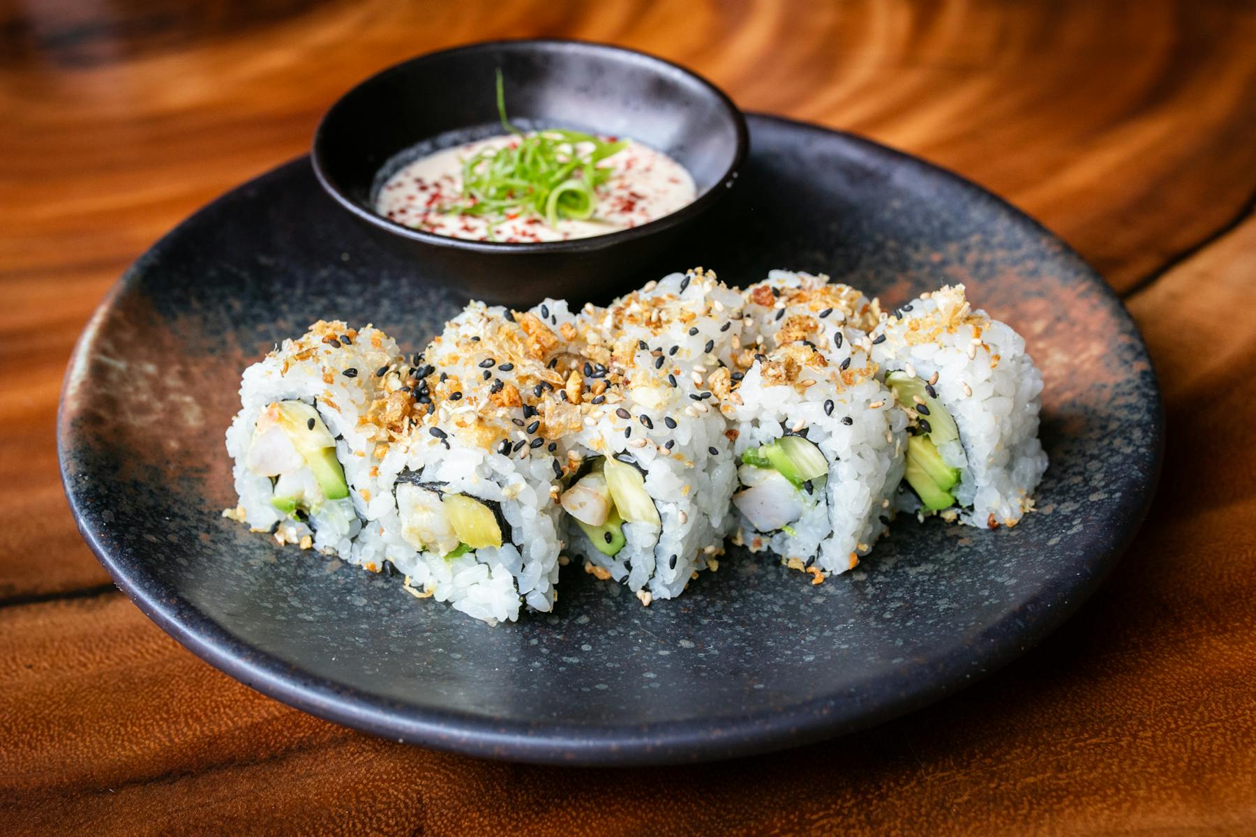 a plate of food on a wooden table