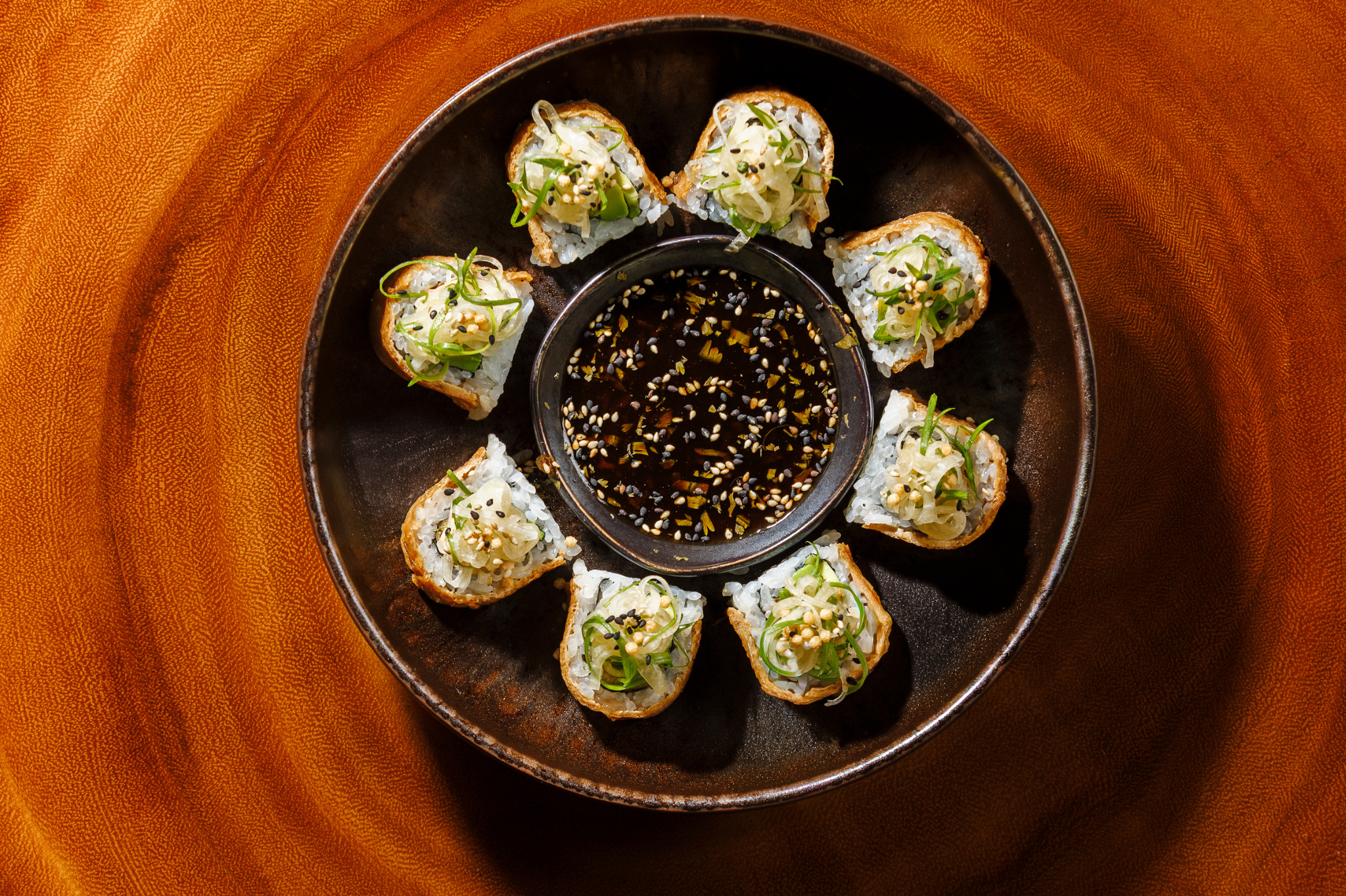 Camote Crunch Roll  tempura sweet potato. avocado. kanzuri chili ranch. inari wrap. ginger ponzu