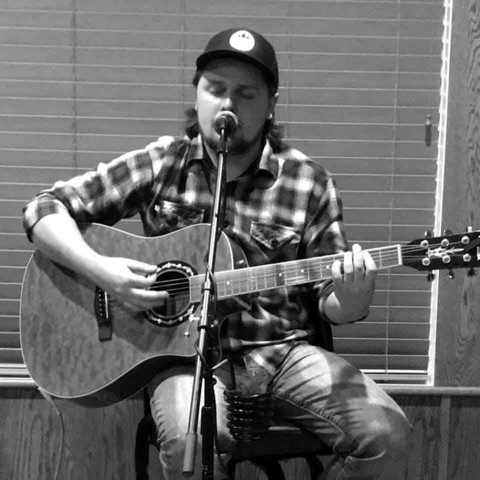 a person sitting on a motorcycle