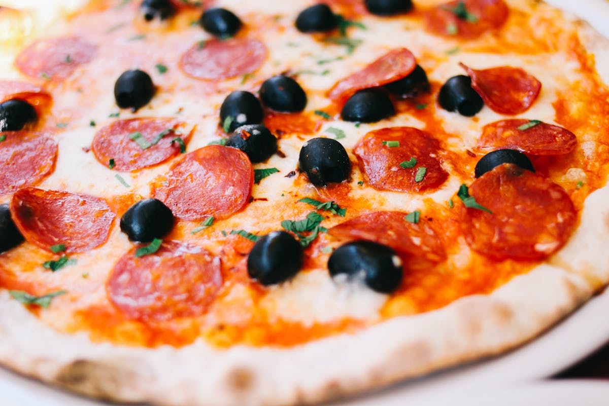 a pizza sitting on top of a table