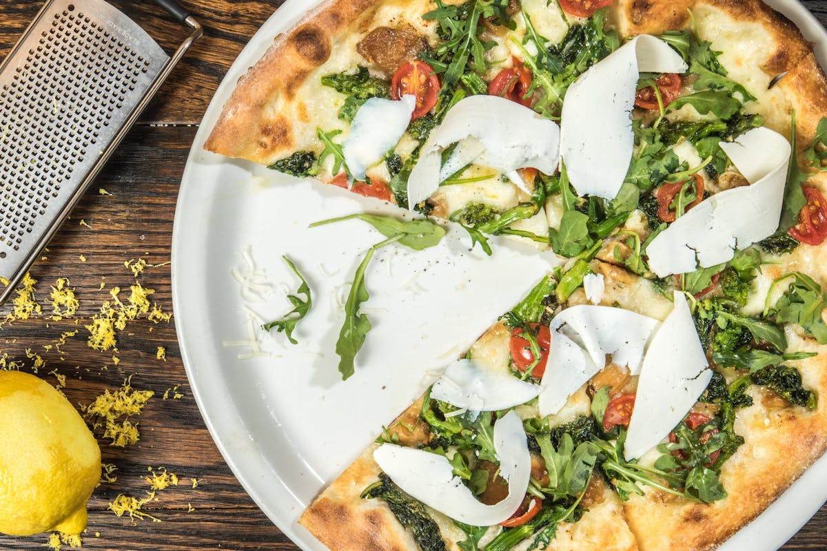 a plate of food with a slice of pizza