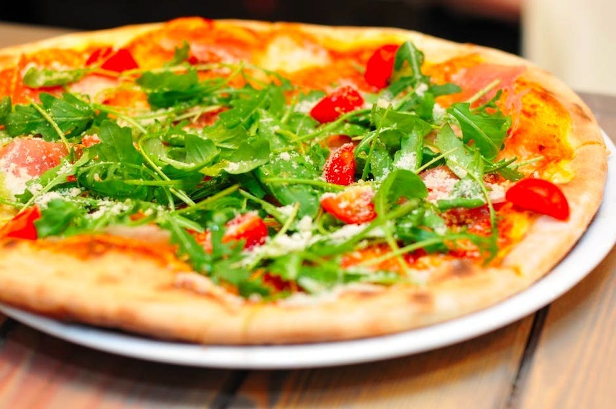 a pizza sitting on top of a table