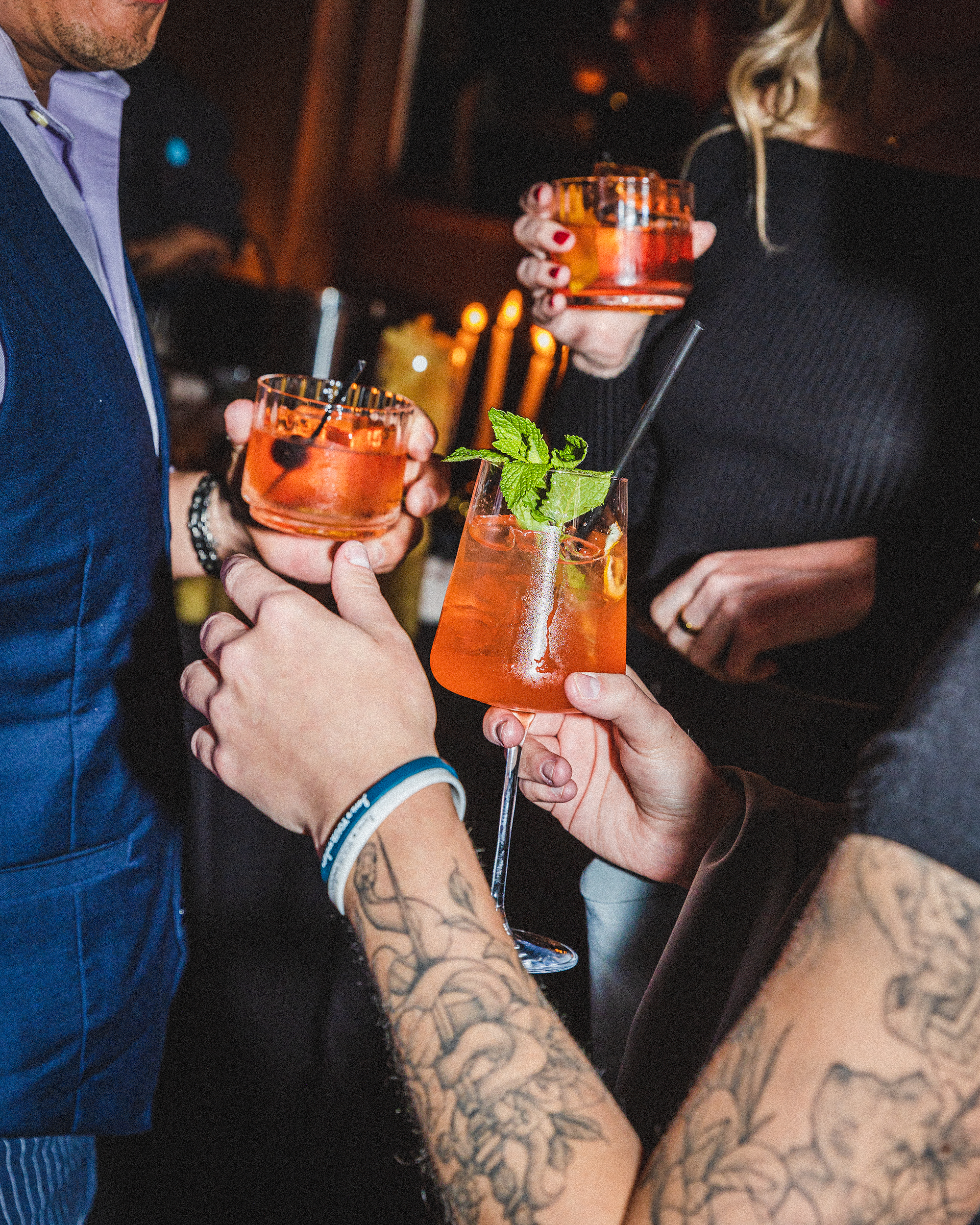 a man holding a glass of orange juice