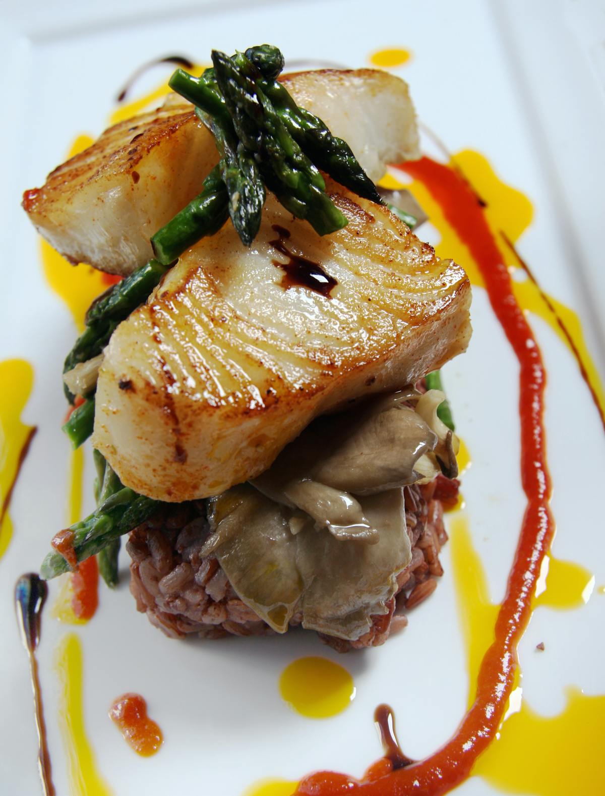 a white plate topped with meat and vegetables