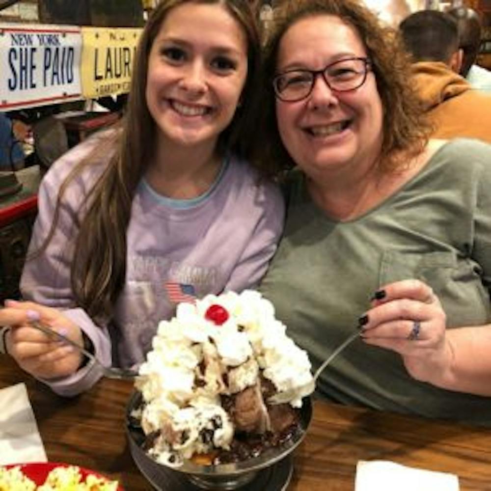 a girl and a woman smiling for the camera