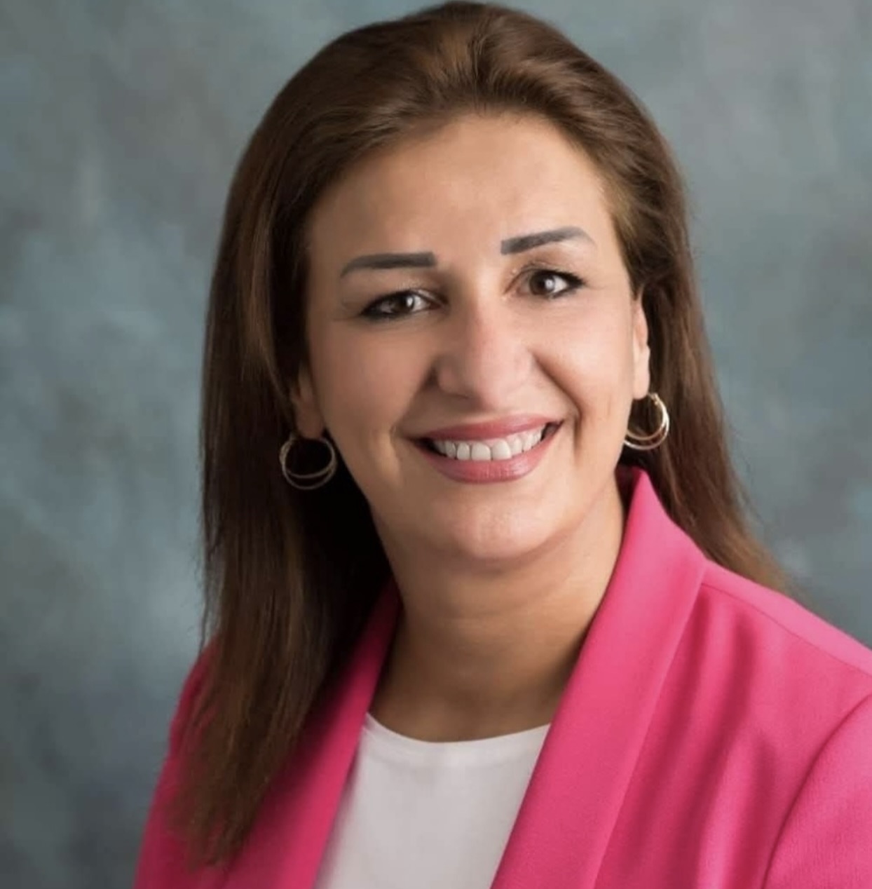 a woman in a pink jacket