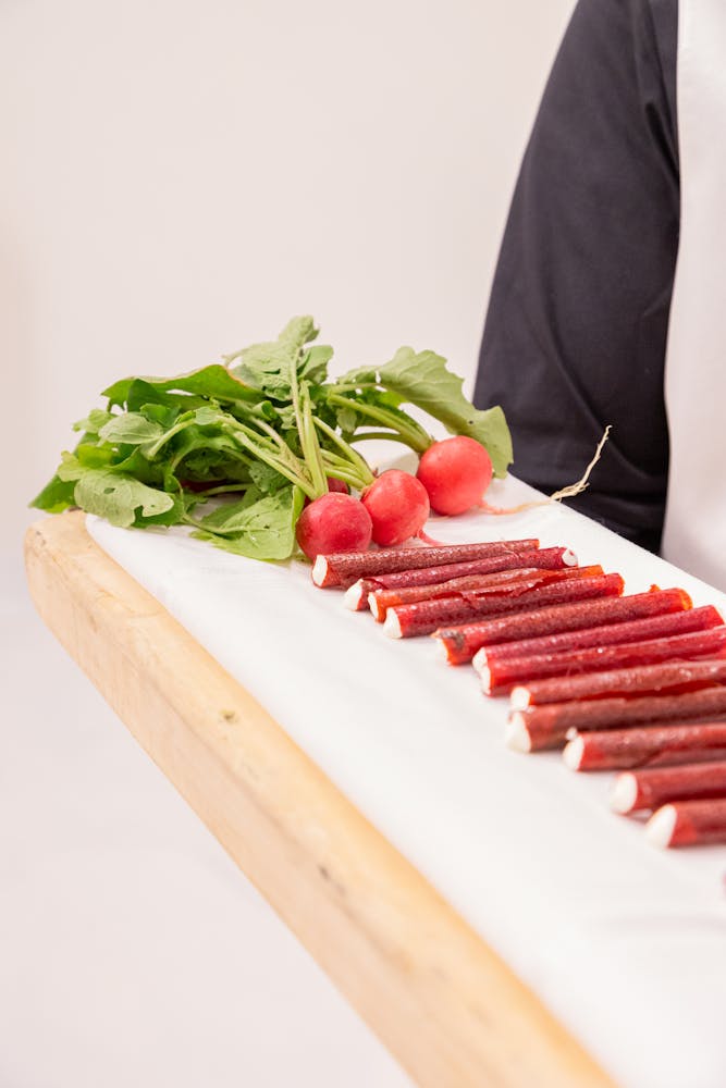 a person sitting on a cutting board