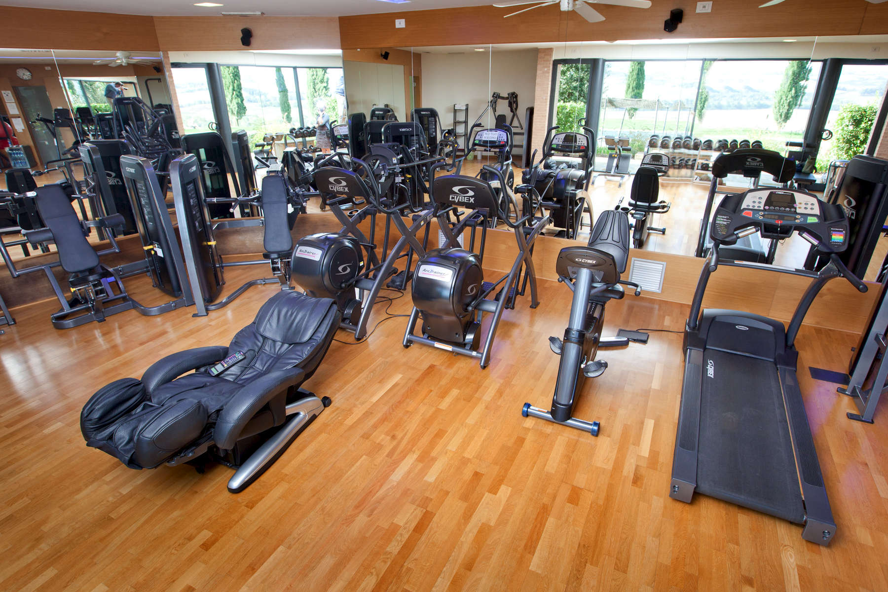 a room filled with furniture on top of a wooden floor