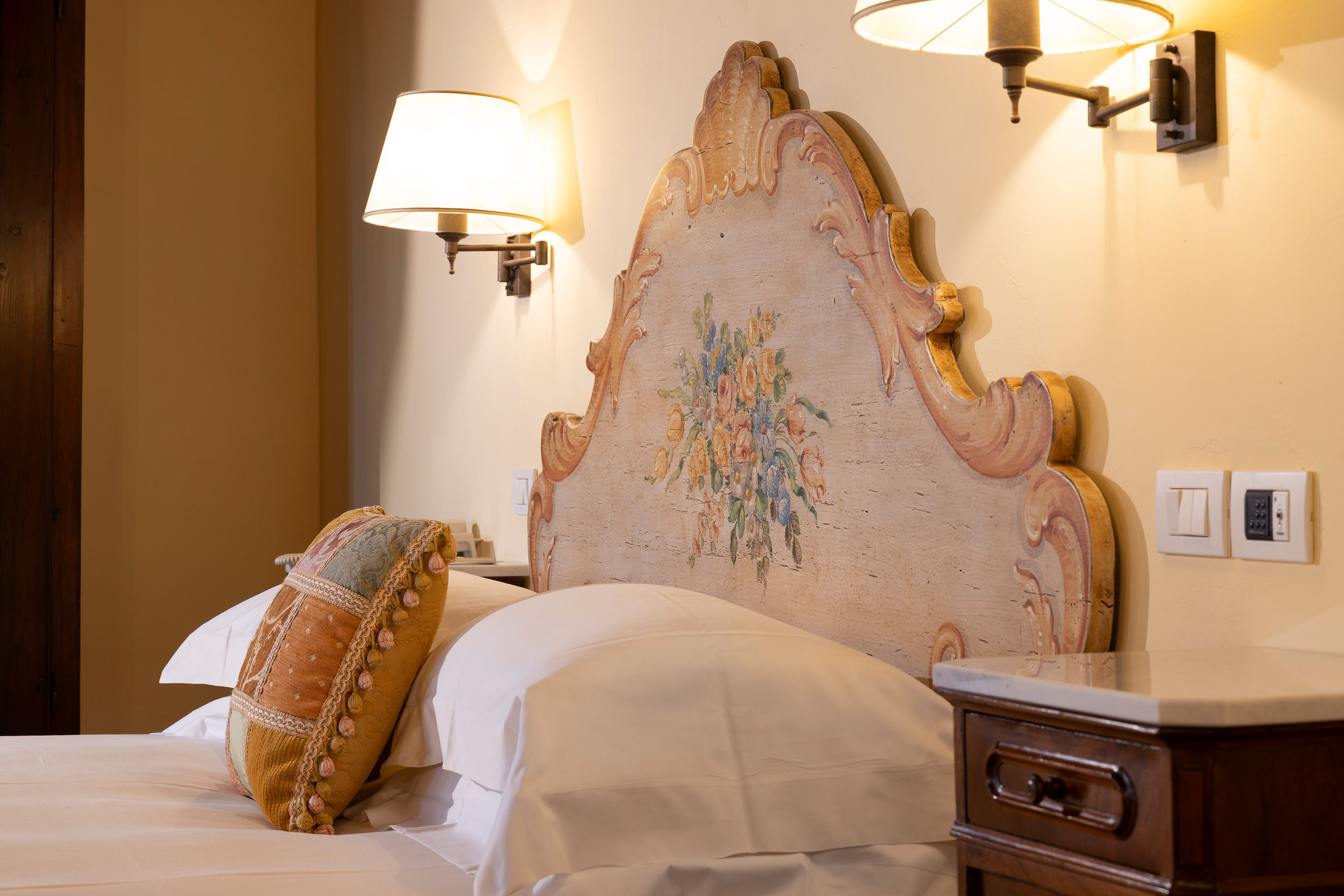 a bedroom with a bed and a mirror