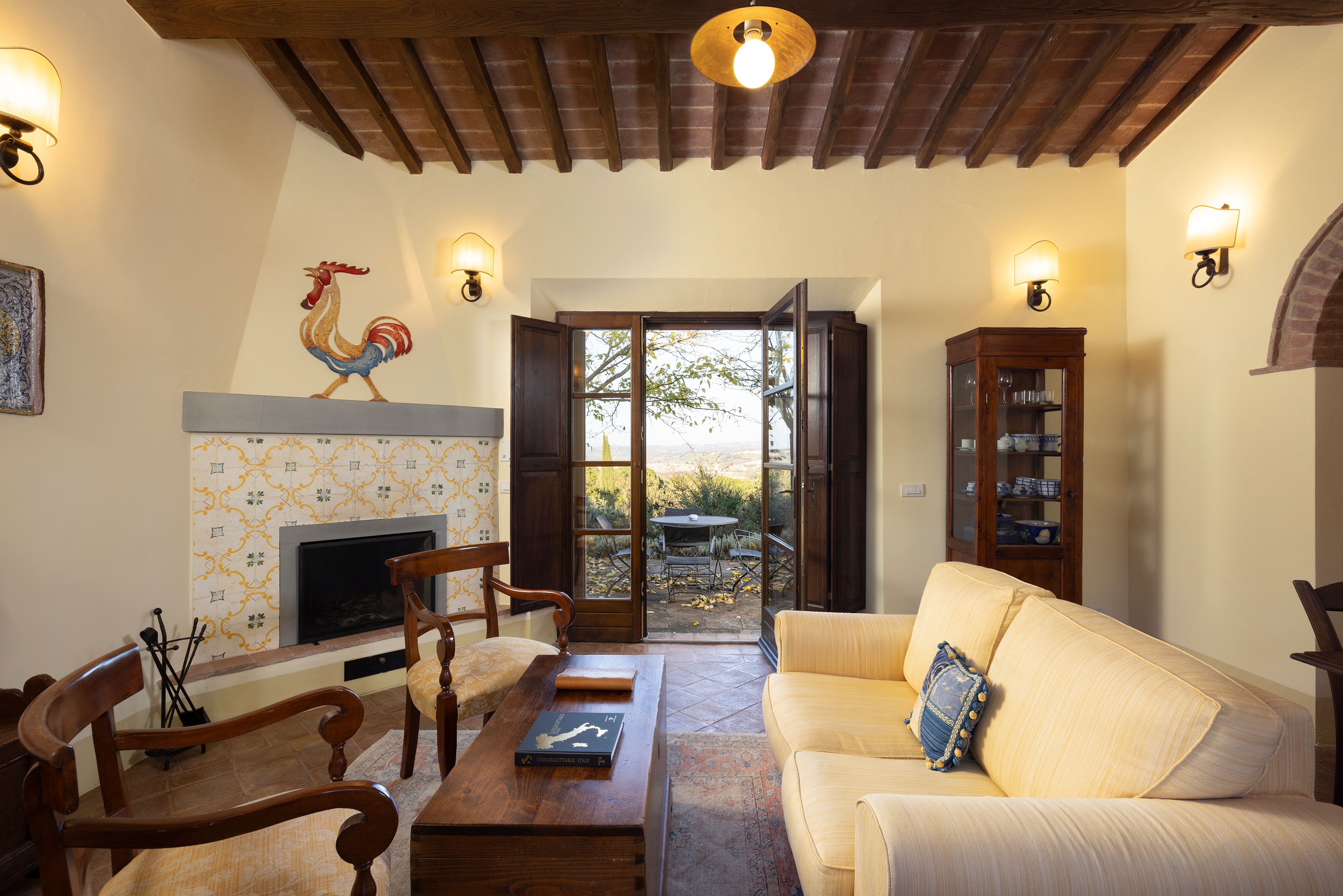 a living room filled with furniture and a fire place