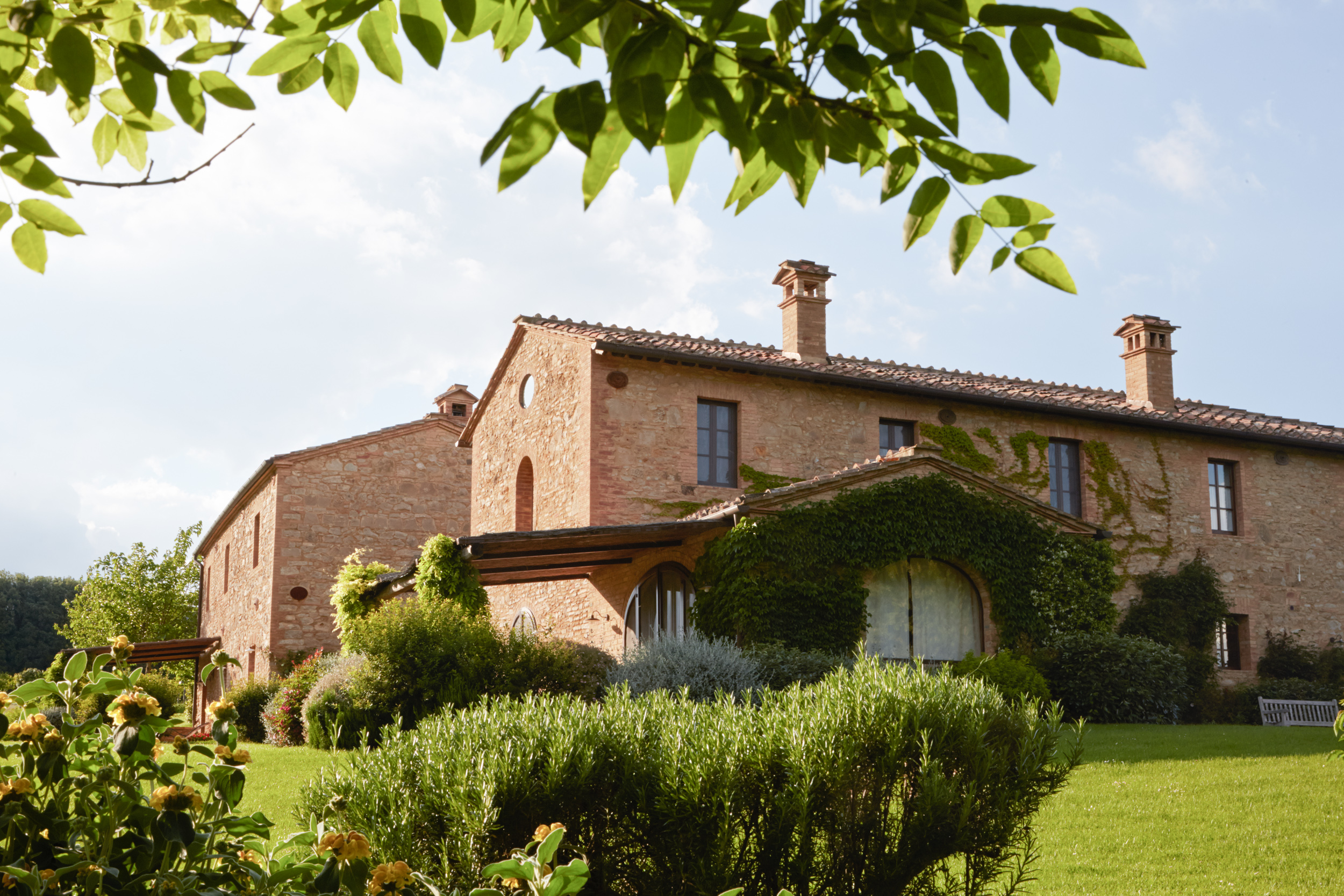 a house with bushes in front of a building