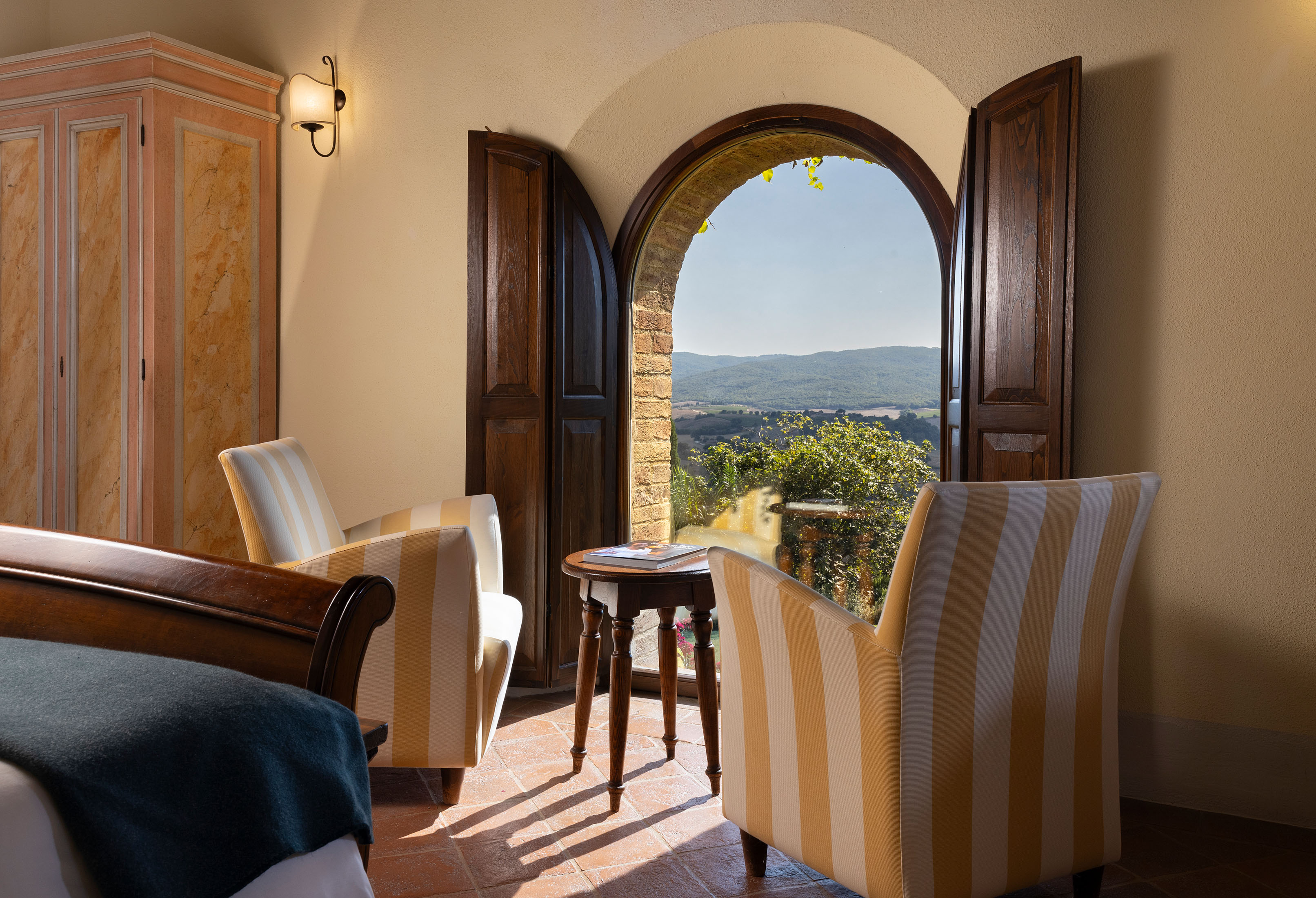 a room filled with furniture and a large window