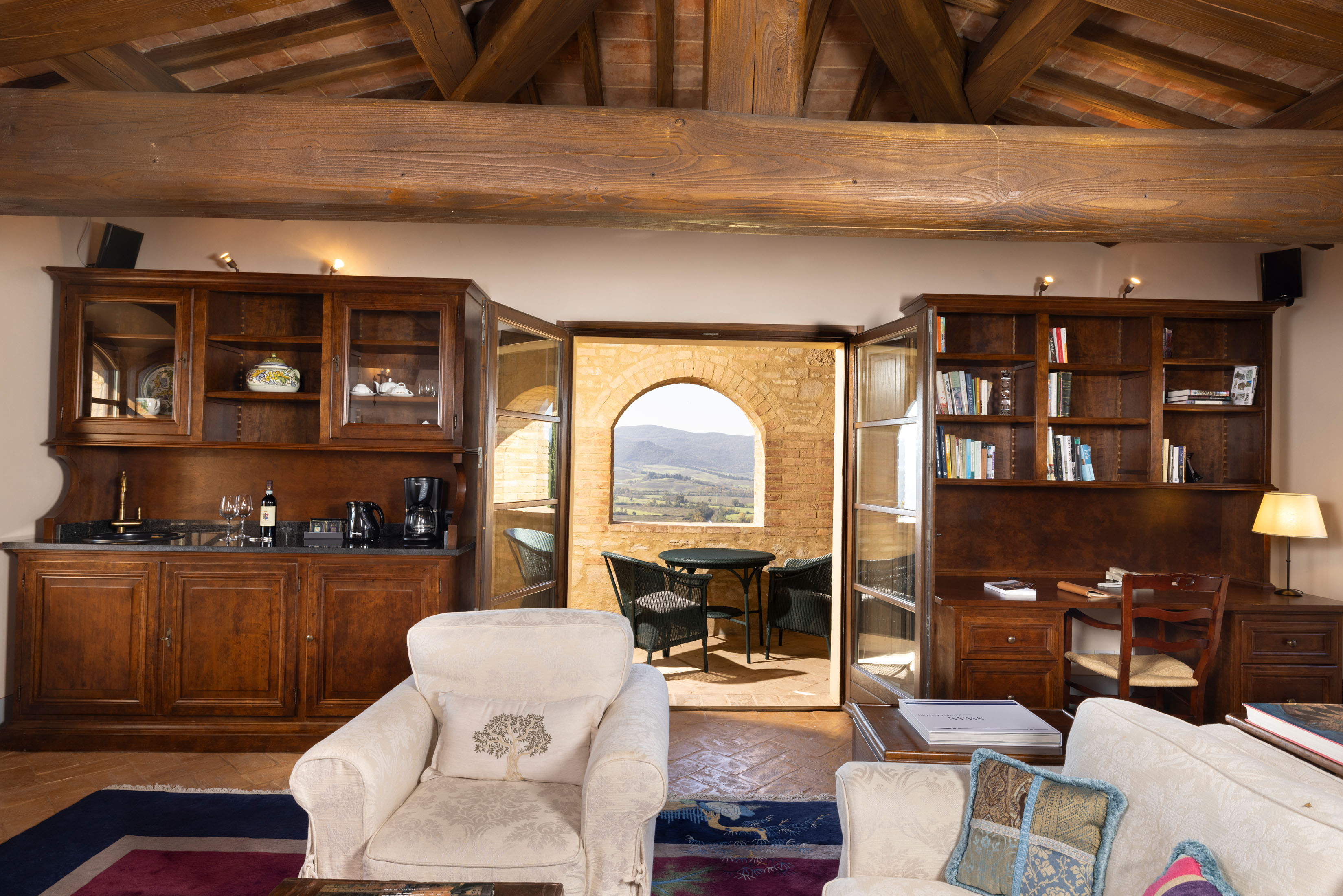 a living room filled with furniture and a fireplace