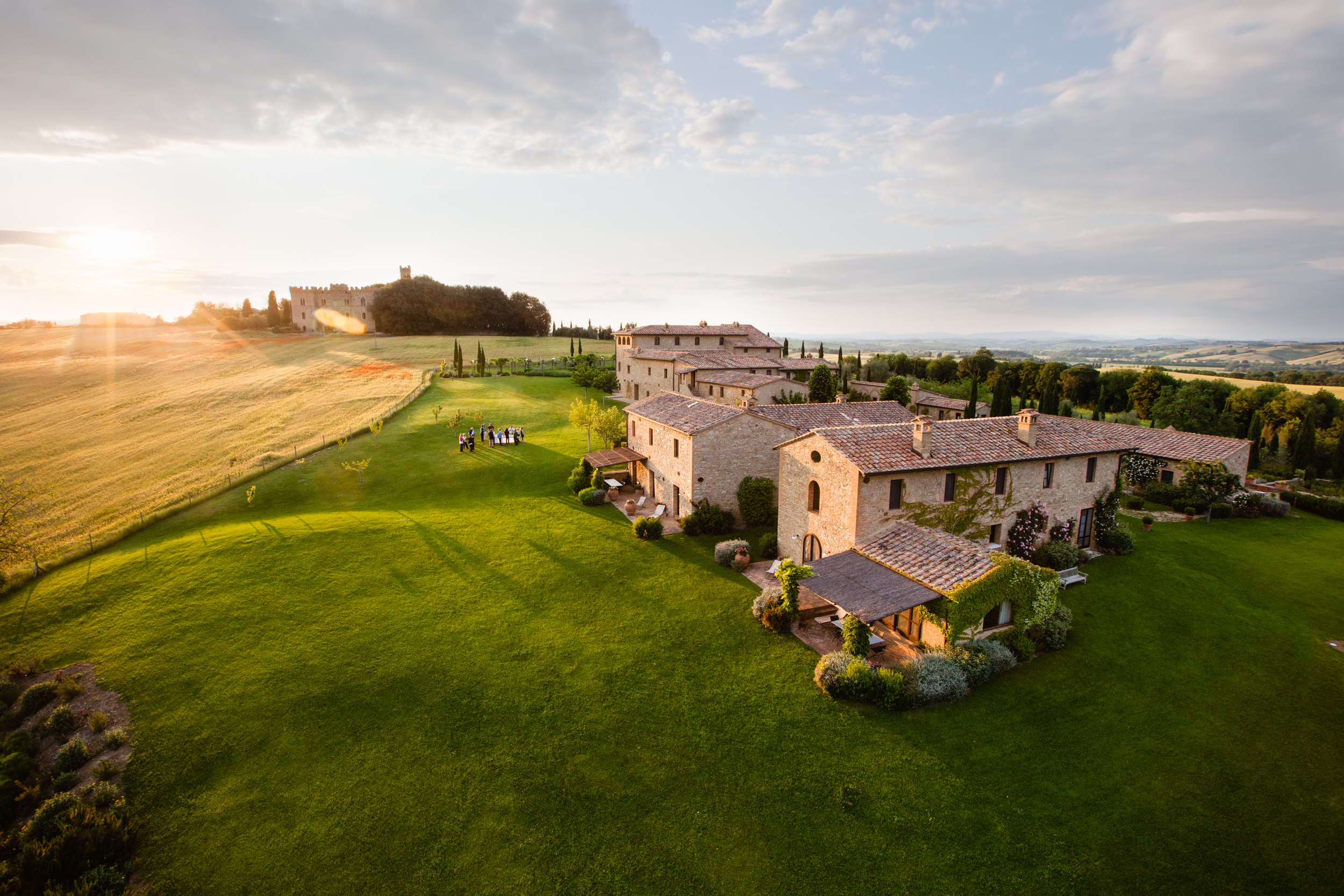 a castle on top of a lush green field