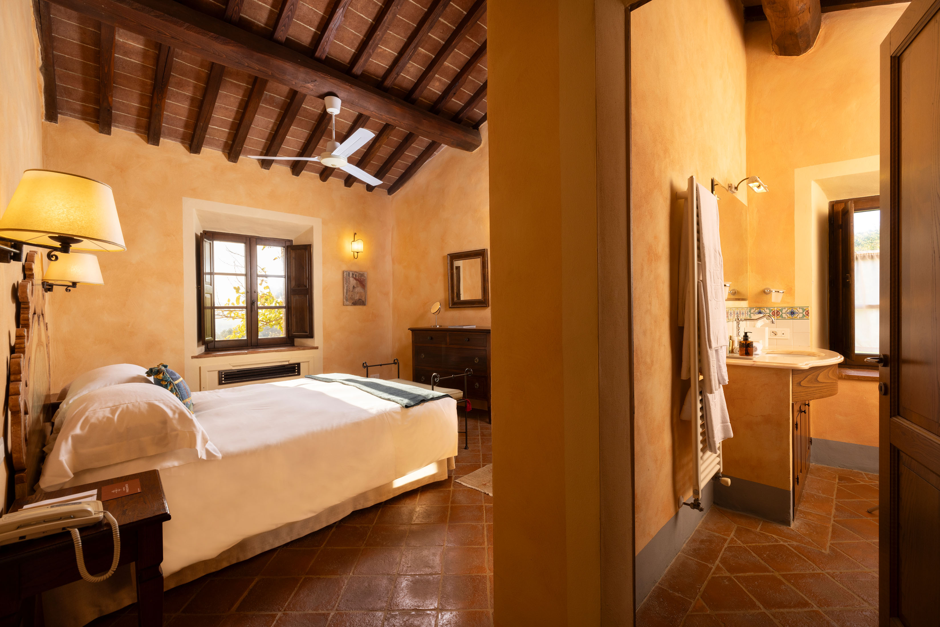 a bedroom with a large mirror