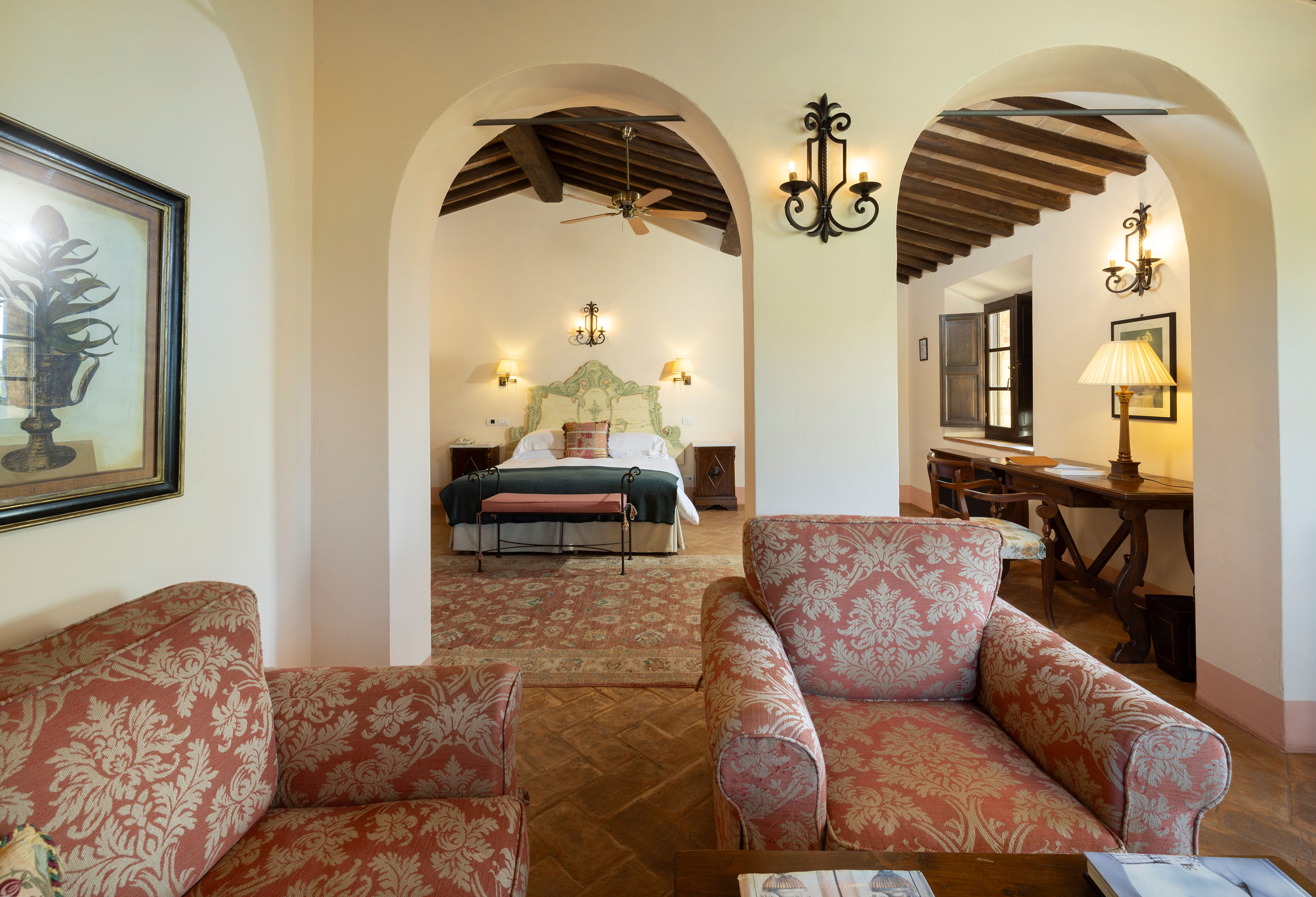 a living room filled with furniture and a fireplace