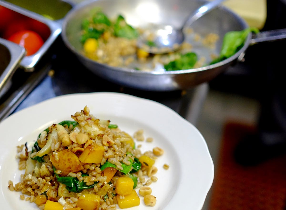 a plate of food with rice and vegetables