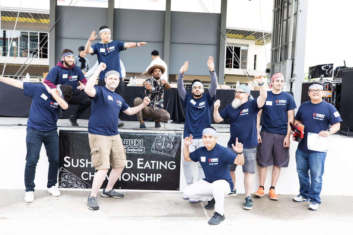 a group of people posing for the camera