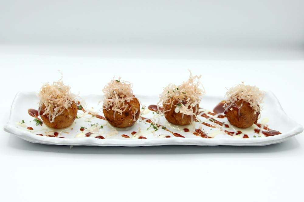 a plate with some cake sitting on top of a table