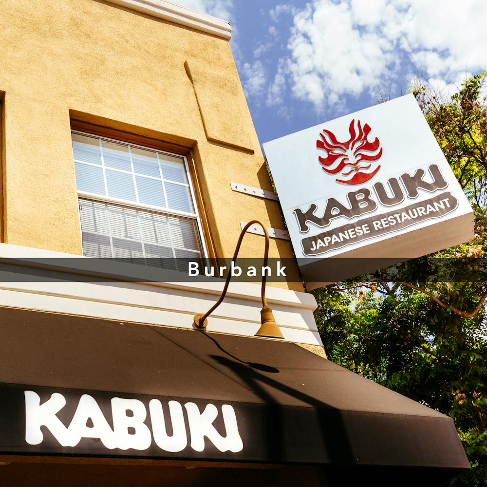 a sign in front of a building