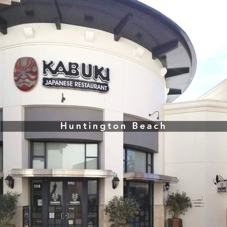 a sign in front of a building