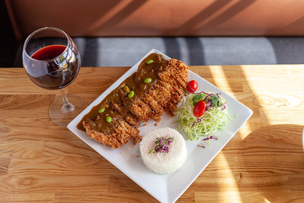 a piece of cake sitting on top of a wooden cutting board