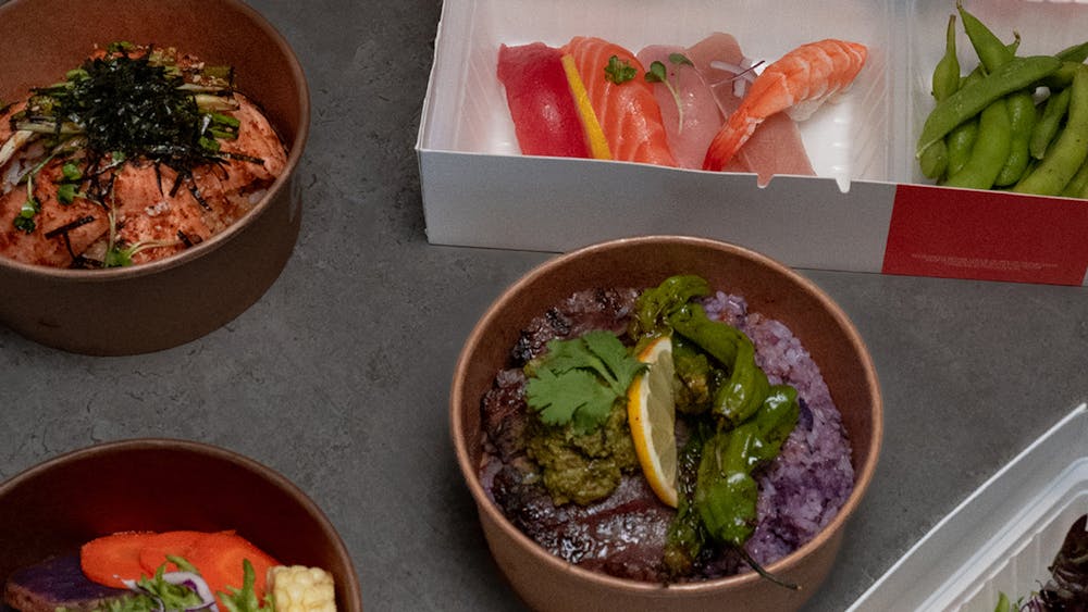 a box filled with different types of food on a table