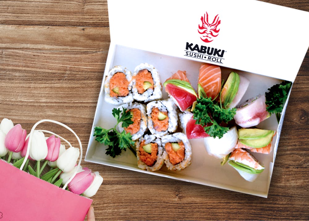 a box filled with different types of food on a table