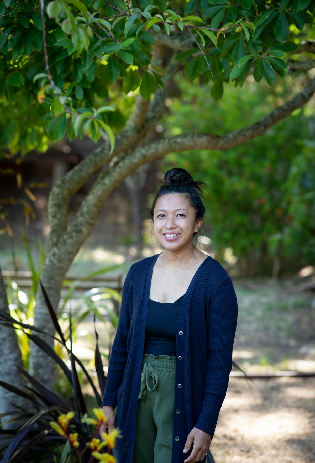 a person standing in front of a tree