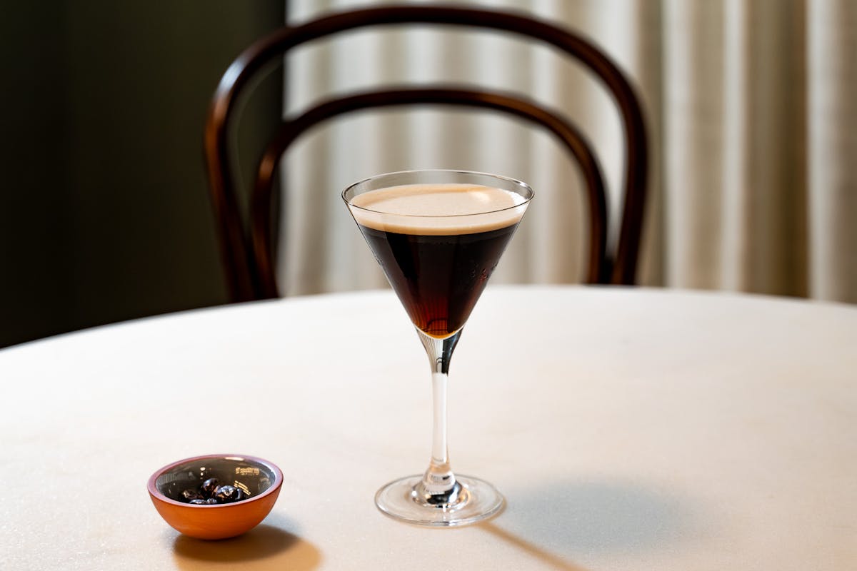 a plate with a glass of wine