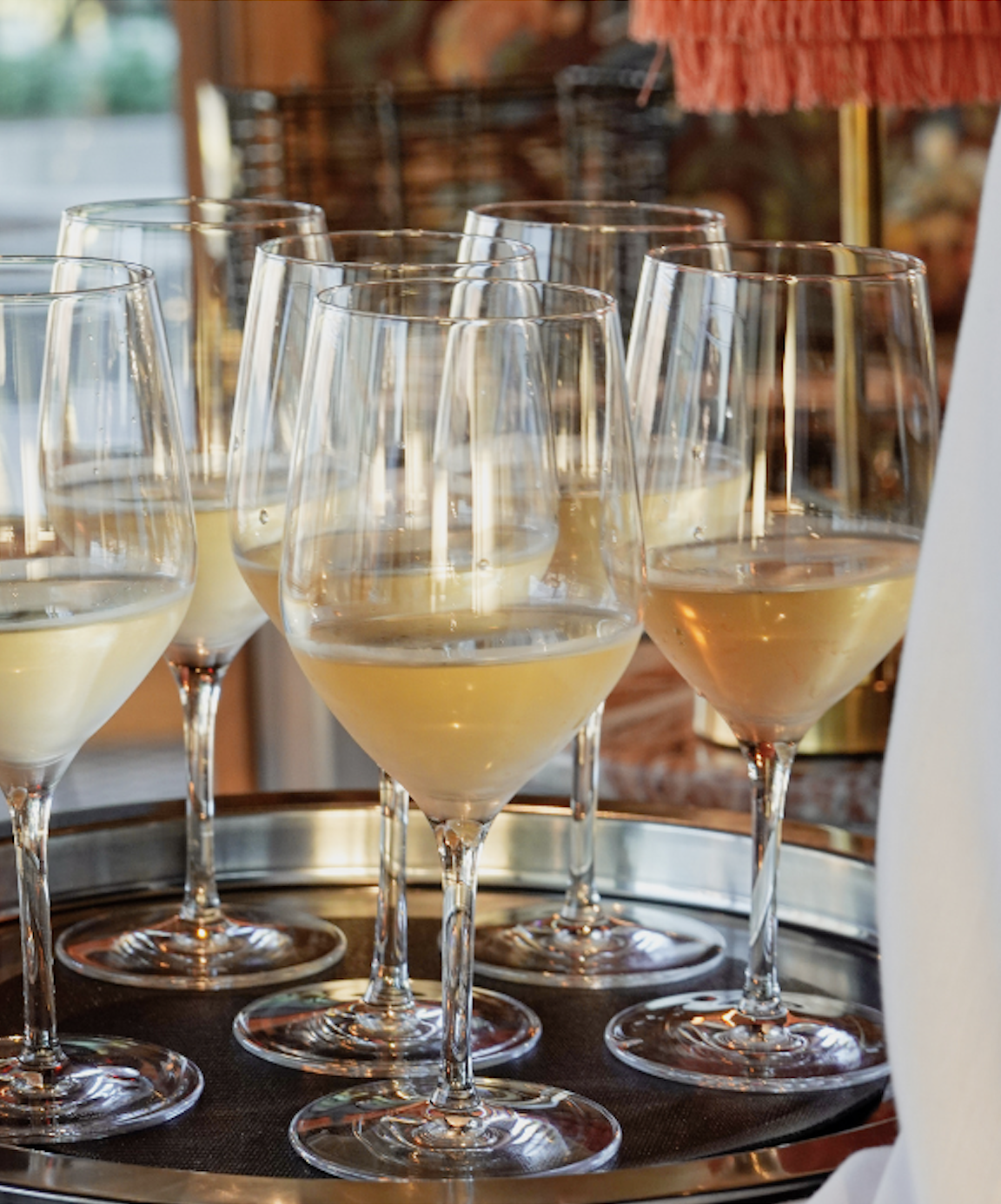 a table topped with glasses of wine